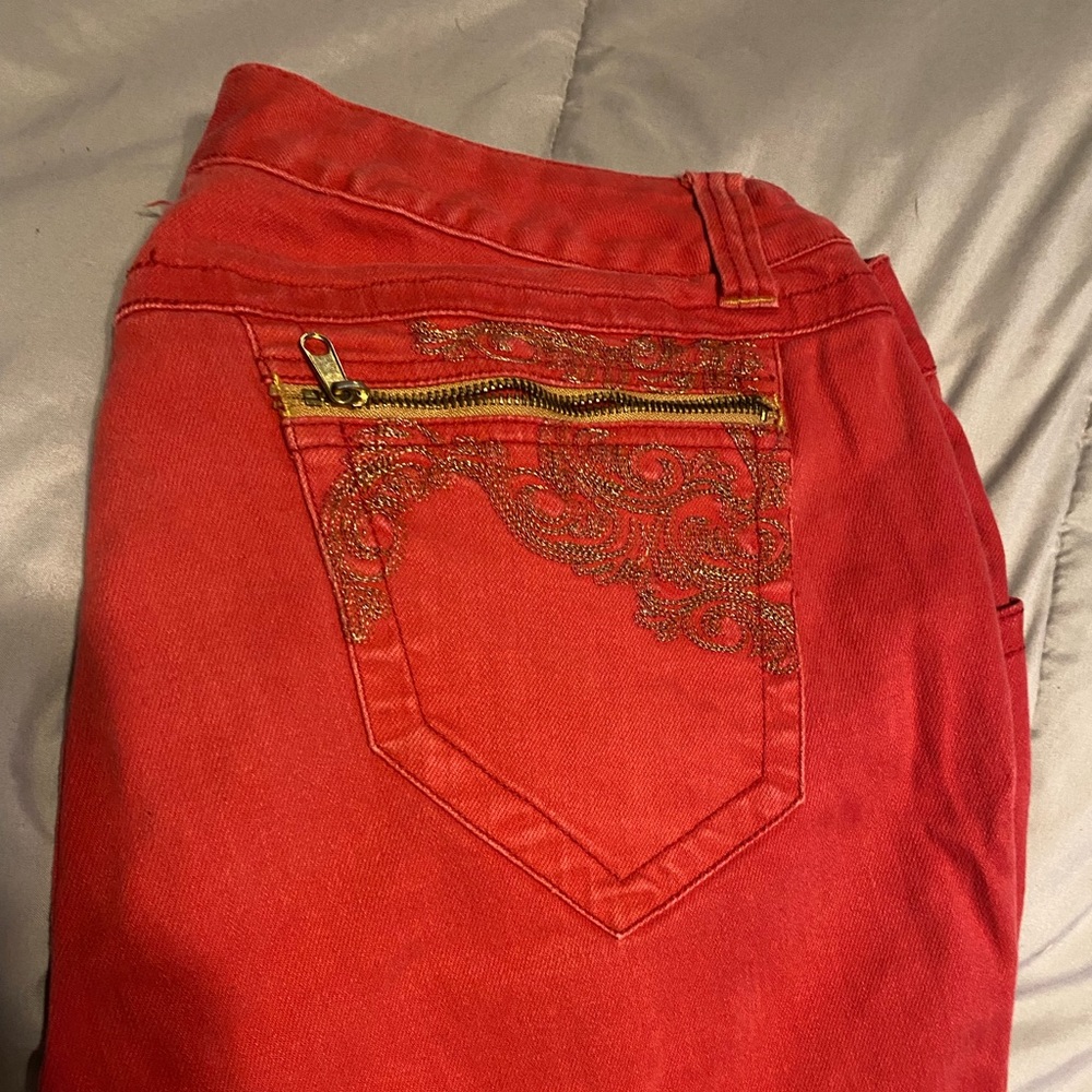 Red orange Venezia pants with cute detailing and zippers. Size 18.